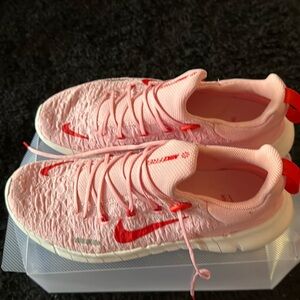Nike Pink and Red Sneakers with Classic Design